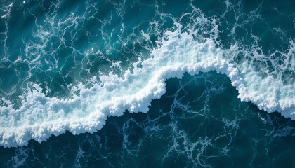 Fototapeta premium Dynamic ocean wave crests with intricate white foam patterns in deep blue water