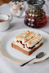 A Delicious Cake adorned with Meringue and filled with Berries