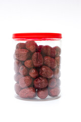 Dried red jujubes isolated on white background. They are a good source of fiber, antioxidants, and...
