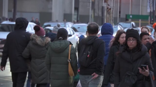 crowd of people walking in slow motion in the street