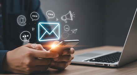 Person using smartphone with email and communication icons nearby