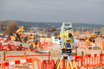 Close-up of Construction survey equipment otal station in use at a building site set by site...