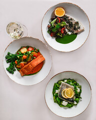Enjoy Sophisticated Seafood Dishes with Fresh Vegetables and Beautiful Garnishes