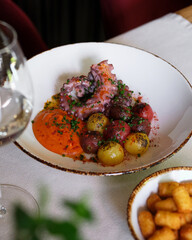 Indulge in a savory and delicious octopus dish served with