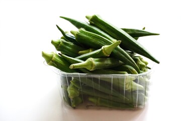 Close-up of fresh okra in basket.