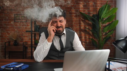 Overwhelmed Businessman Under Stress at Office Desk