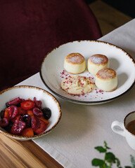 A Delicious, Aromatic Dessert Featuring Fresh Fruits Alongside a Cup