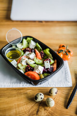 Healthy vegetable salad with tomatoes, peppers, cucumbers, onion and cheese.