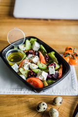 Healthy vegetable salad with tomatoes, peppers, cucumbers, onion and cheese.