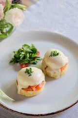 Indulge in the mouthwatering and delicious Eggs Benedict served with
