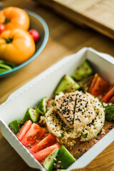 Healthy vegetable salad with tomatoes, peppers, cucumbers, onion and cheese.