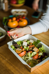 Healthy vegetable salad with tomatoes, peppers, cucumbers, onion and cheese.