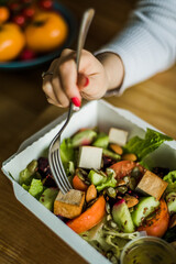 Healthy vegetable salad with tomatoes, peppers, cucumbers, onion and cheese.