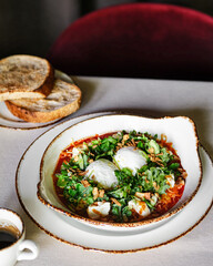 A Delectable and Savory Dish Featuring Poached Eggs, Fresh Ingredients