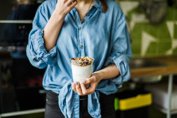 Healthy breakfast with yogurt, granola and chia seeds.