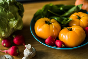 Healthy vegetable salad with tomatoes, peppers, cucumbers, onion and cheese.