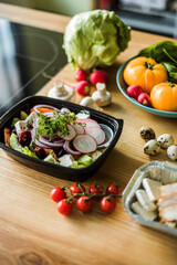 Healthy vegetable salad with tomatoes, peppers, cucumbers, onion and cheese.