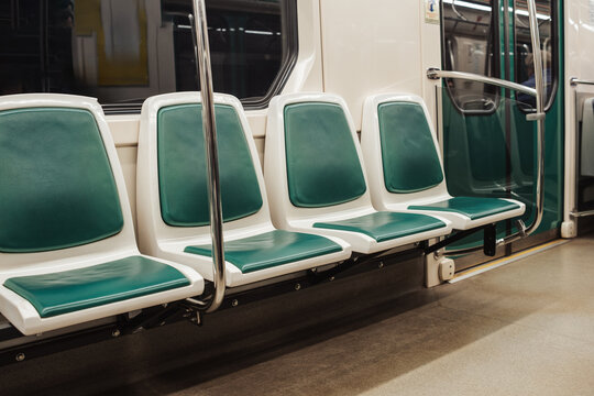 Clean and Empty Subway Train Seats Waiting for Passengers During a Quiet Morning Commute in an Urban Setting