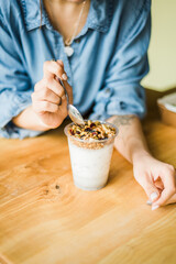 Healthy breakfast with yogurt, granola and chia seeds.