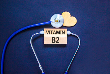 Vitamin B2 riboflavin symbol. Concept words Vitamin B2 on beautiful wooden blocks. Wooden heart and...