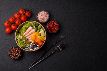 Bowl with shrimps, seafood, rice, oranges, tomatoes with sauce. Bowl with prawns