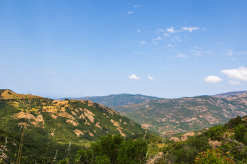Fototapeta premium Mountain view with green and rocky slopes, Greece, Corfu, 17 June 2025