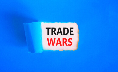Trade wars symbol. Concept word Trade wars on beautiful white paper. Beautiful blue paper background. Business trade wars concept. Copy space.