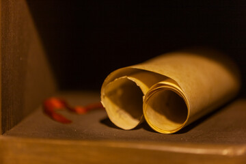 Antique scroll manuscript on shelv