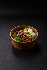 Seafood bowl, tuna tataki fillet slices with rice, oranges, tomatoes and sauce. Tuna bowl
