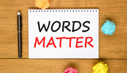 Words matter symbol. Concept word Words matter on beautiful white note. Black pen, colored paper....
