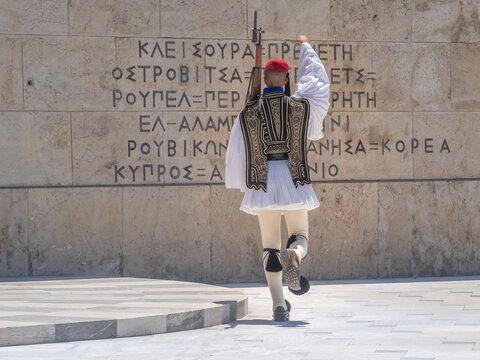 Presidential guard (Evzone) performing a salute at the Tomb of the Unknon Soldier, Hellenic Parliament, Syntagma Square, Athens, Attica, Greece