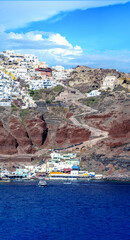 Negotiating the zig-zagging stairs from sea level to reach the charming village of Oia oin the edge...