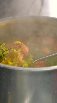 Crab Rasam Getting Boiled and Prepared in a Big Vessel