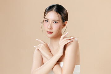 Young Asian woman portrait natural make up cosmetic on face radiant eyes lip gloss happy touch her...