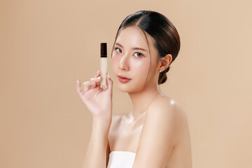 Young Asian woman portrait natural make up cosmetic on face radiant eyes lip gloss happy touch her...