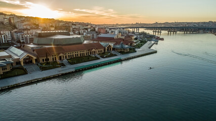 Halic Congress Center in Istanbul captured by drone at sunrise, featuring urban skyline and modern buildings.