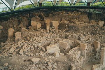 Gobeklitepe archaeological site in Sanliurfa, Turkey, showcasing ancient pillars, historic structures, and cultural heritage.