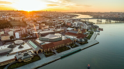 Aerial footage of Halic Congress Center in Istanbul during sunrise, showcasing contemporary design and waterfront.