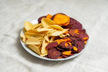 Assorted vegetable chips on plate