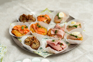 Assorted canapes on silver platter