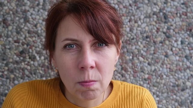 face of angry woman dissatisfied with life and everything that happens. man is grimacing