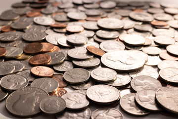 Pile of Golden coin, silver coin, copper coin, quarters, nickels, dimes, pennies, fifty cent piece and dollar coins. Various USA coins, American coins for business, money, financial coins and economy