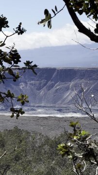20 October 2024, USA, Hawaii, The Big Island, Pāhoa, Volcanoes National Park, Kilauea Overlook - dramatic windy panoramic landscape view of summit lava field on bright sunny day no eruptions but smoke