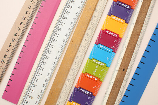 Stationery calculator ruler calculator and school stuff on coloured background. Concept of school and college learning