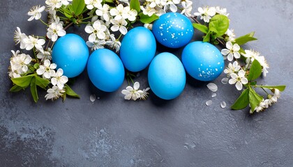 Blue Easter eggs with spring flowers.
