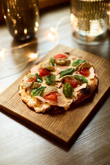 Gourmet Flatbread Pizza with Fresh Basil and Tomatoes