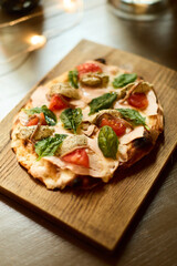 Gourmet Flatbread Pizza with Fresh Basil and Tomatoes
