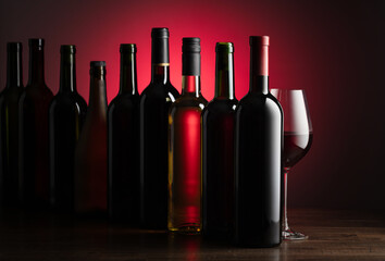 Bottles of wine on a old wooden table.
