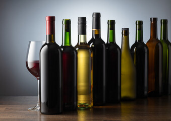 Bottles of wine on a old wooden table.