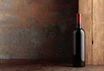 Bottle of red wine on a vintage background.